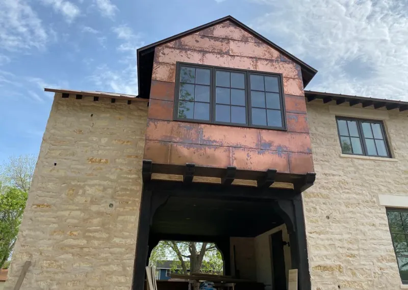 Copper metal panel facade on a stone building for Metal Roof Coating in Billings